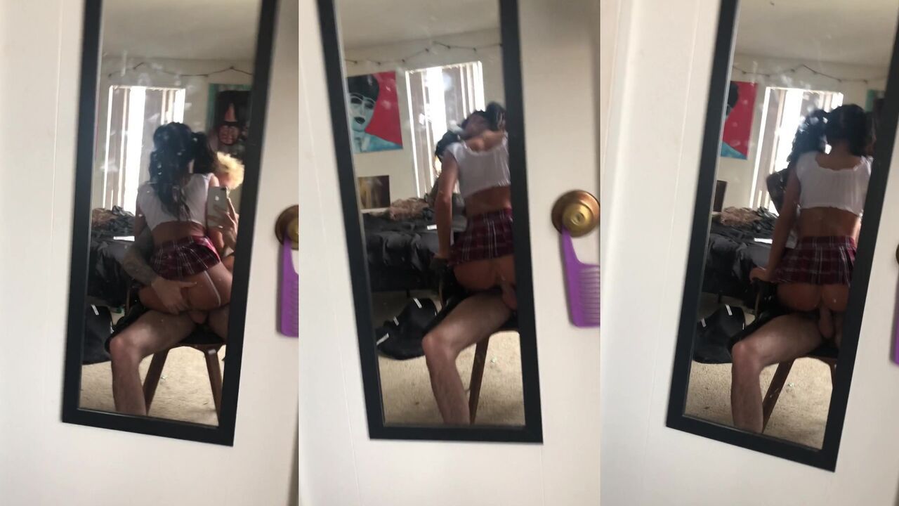 Teen couple chair ride selfie