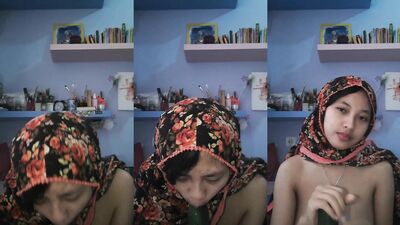 Indonesian girl playing with cucumber