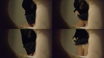 Unaware female spied through a wall hole while she pulled her skirt up to urinate